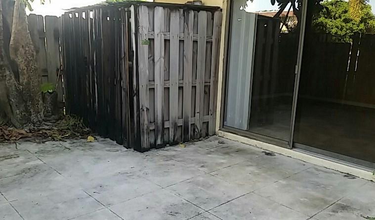 153 Woodland Road Palm Springs, FL 33461 - Photo 2 of 7 Courtyard