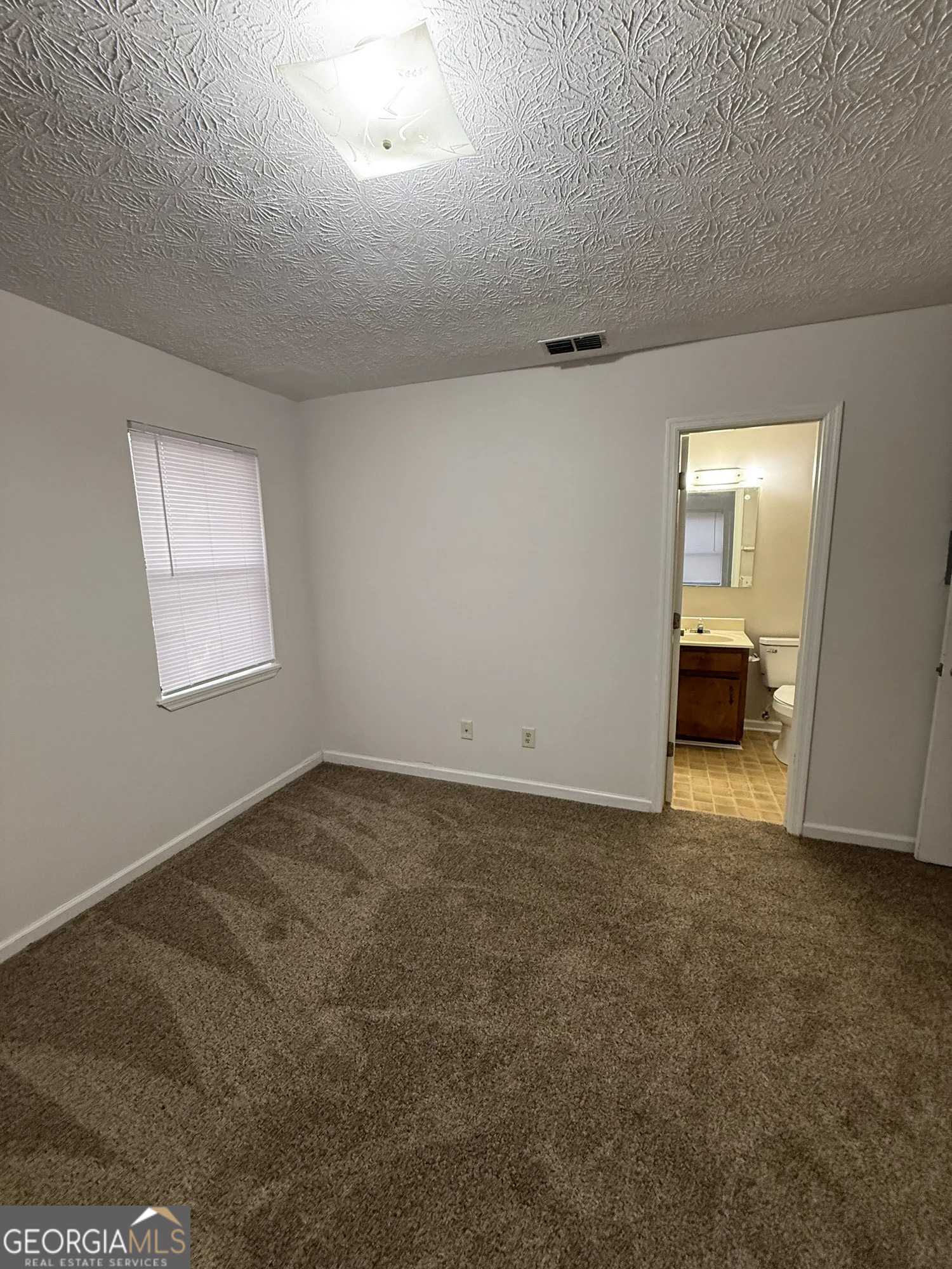 175 West Paces Drive Athens, GA 30605 - Photo 15 of 16 a view of an empty room with a window