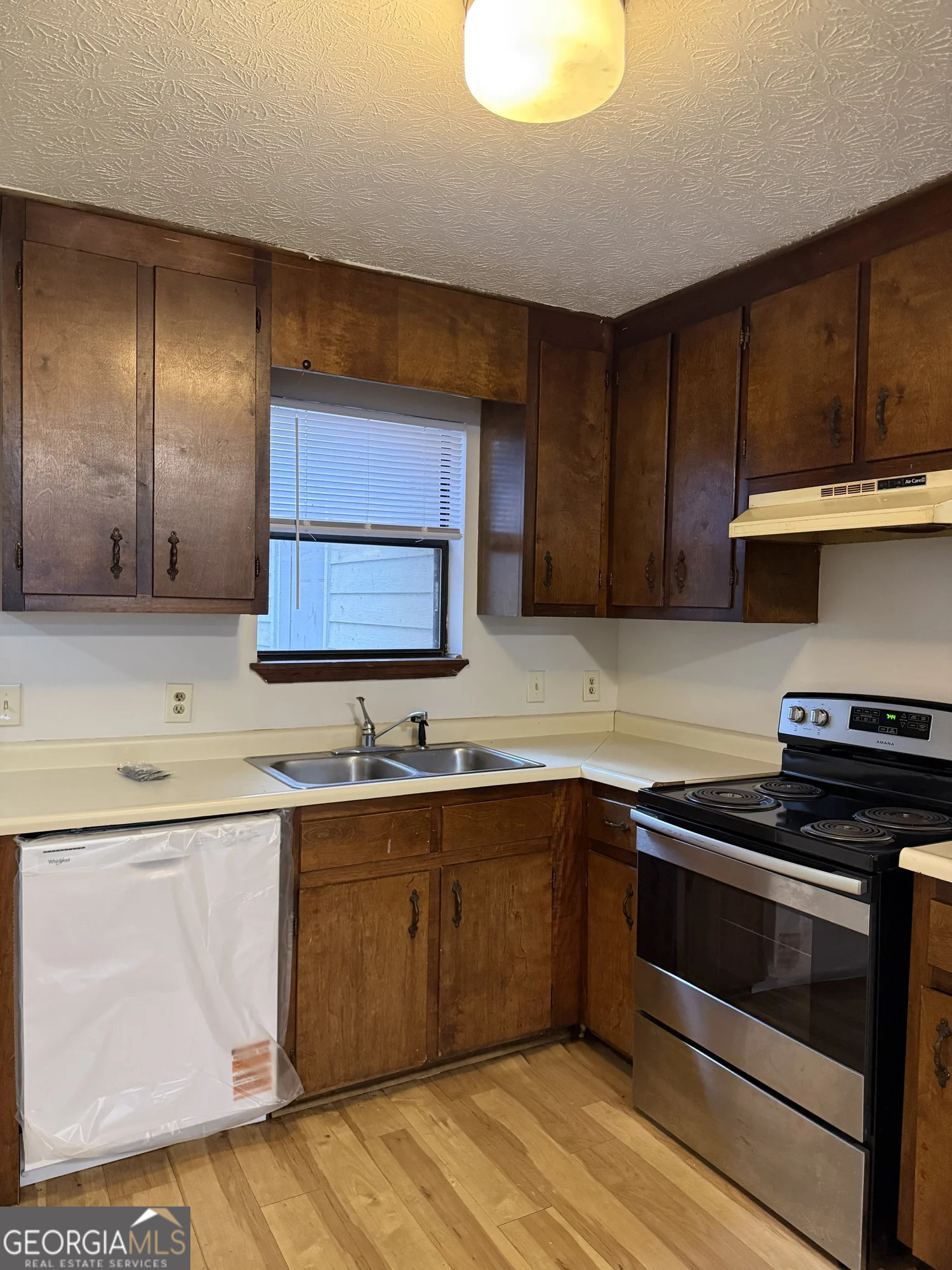 175 West Paces Drive Athens, GA 30605 - Photo 4 of 16 a kitchen with a sink stove and cabinets