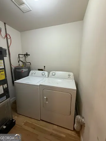 a utility room with dryer and washer