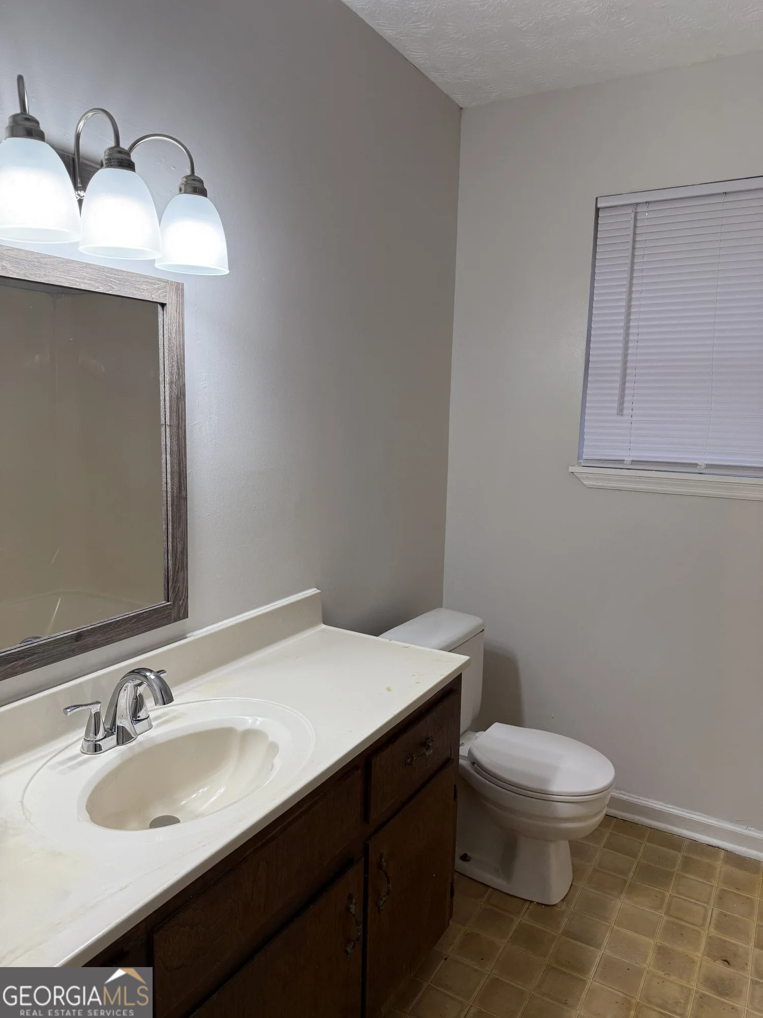175 West Paces Drive Athens, GA 30605 - Photo 7 of 16 a bathroom with a sink toilet and vanity