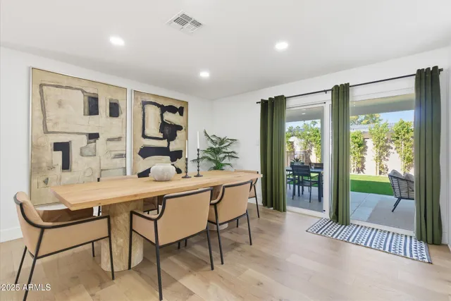 a dining room with furniture and window