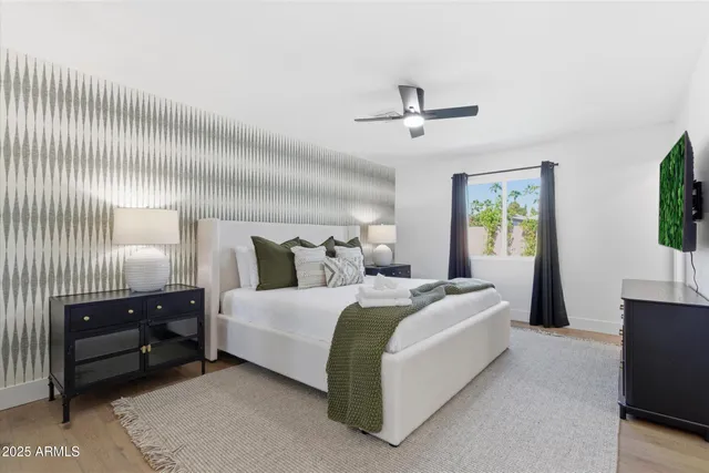 a bedroom with bed and window