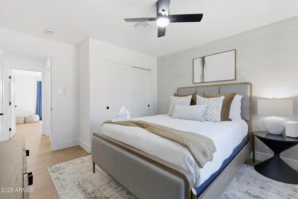 a bedroom with bed and window