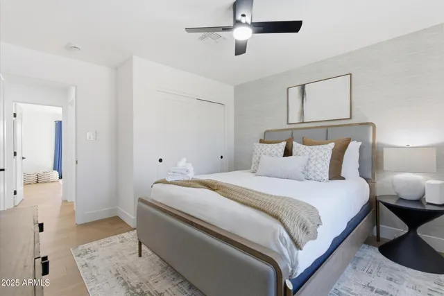 a bedroom with bed and window