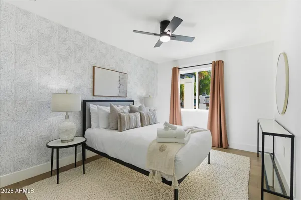 a bathroom with a granite countertop sink a toilet and shower