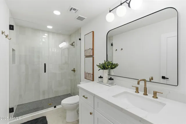 a bathroom with a double vanity sink mirror and double