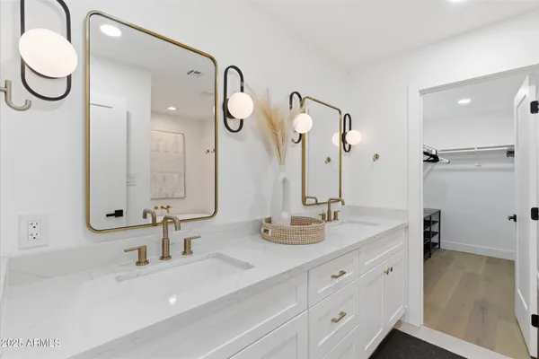 a white bath tub sitting next to a bathroom