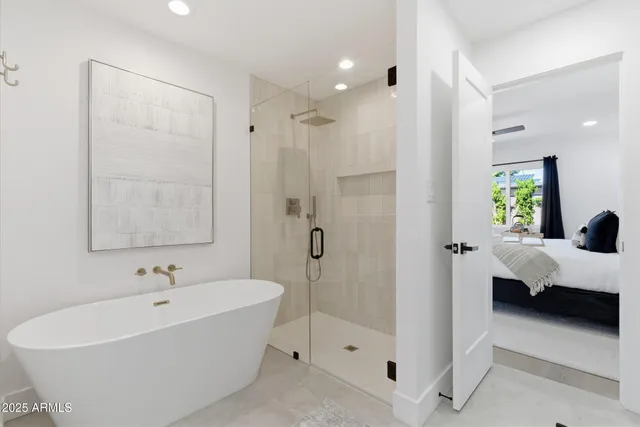 a bathroom with a bathtub shower sink and toilet