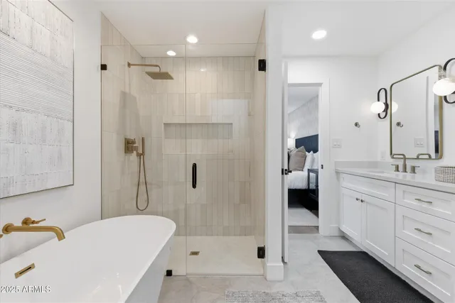 a spacious bathroom with a double vanity sink and a mirror