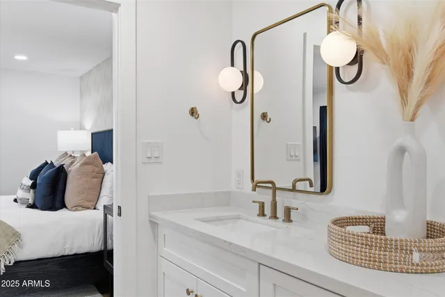 a bathroom with a sink and a mirror