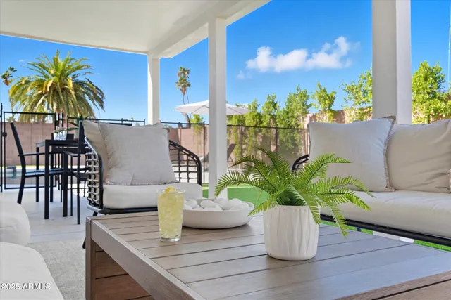a view of house with backyard and patio