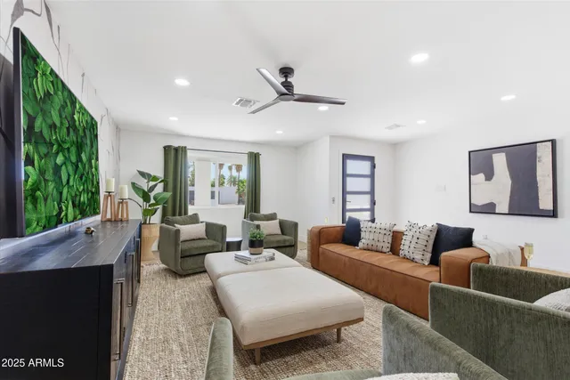 a living room with furniture and a large window