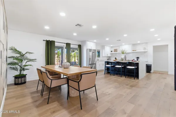 a kitchen with a table and chairs in it