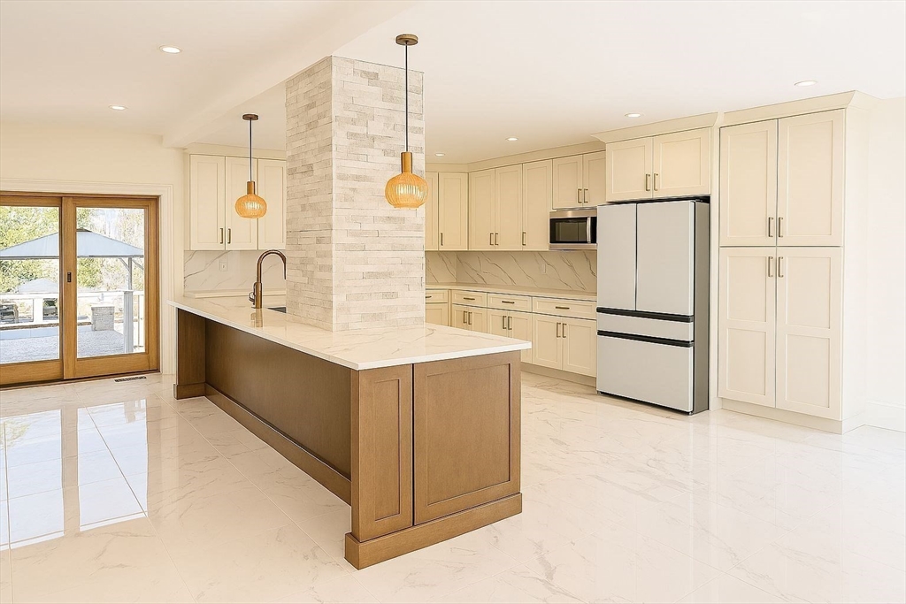 195 Lower Gore Road Webster, MA 01570 - Photo 4 of 24 a kitchen with stainless steel appliances a refrigerator sink and cabinets