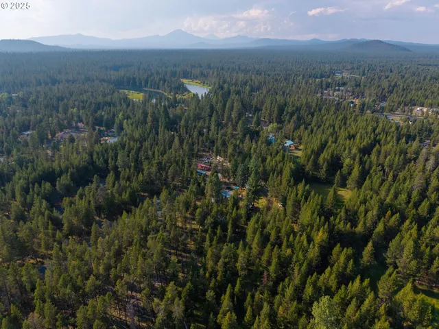 a view of a yard with an outdoor seating