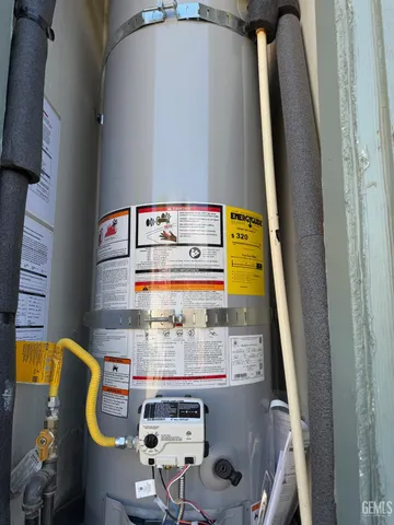 a view of the house with backyard and sitting area