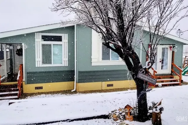 a view of living room filled with furniture and a window