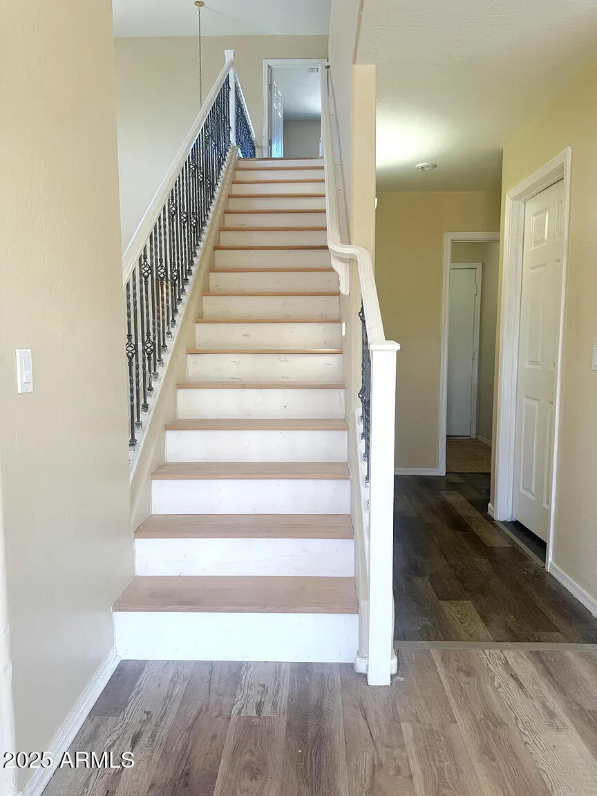 3545 East Crescent Way Gilbert, AZ 85298 - Photo 15 of 39 a view of a hallway with wooden floor and entryway