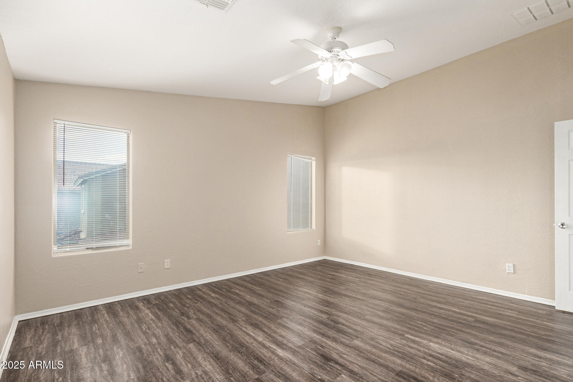3545 East Crescent Way Gilbert, AZ 85298 - Photo 18 of 39 an empty room with wooden floor and windows
