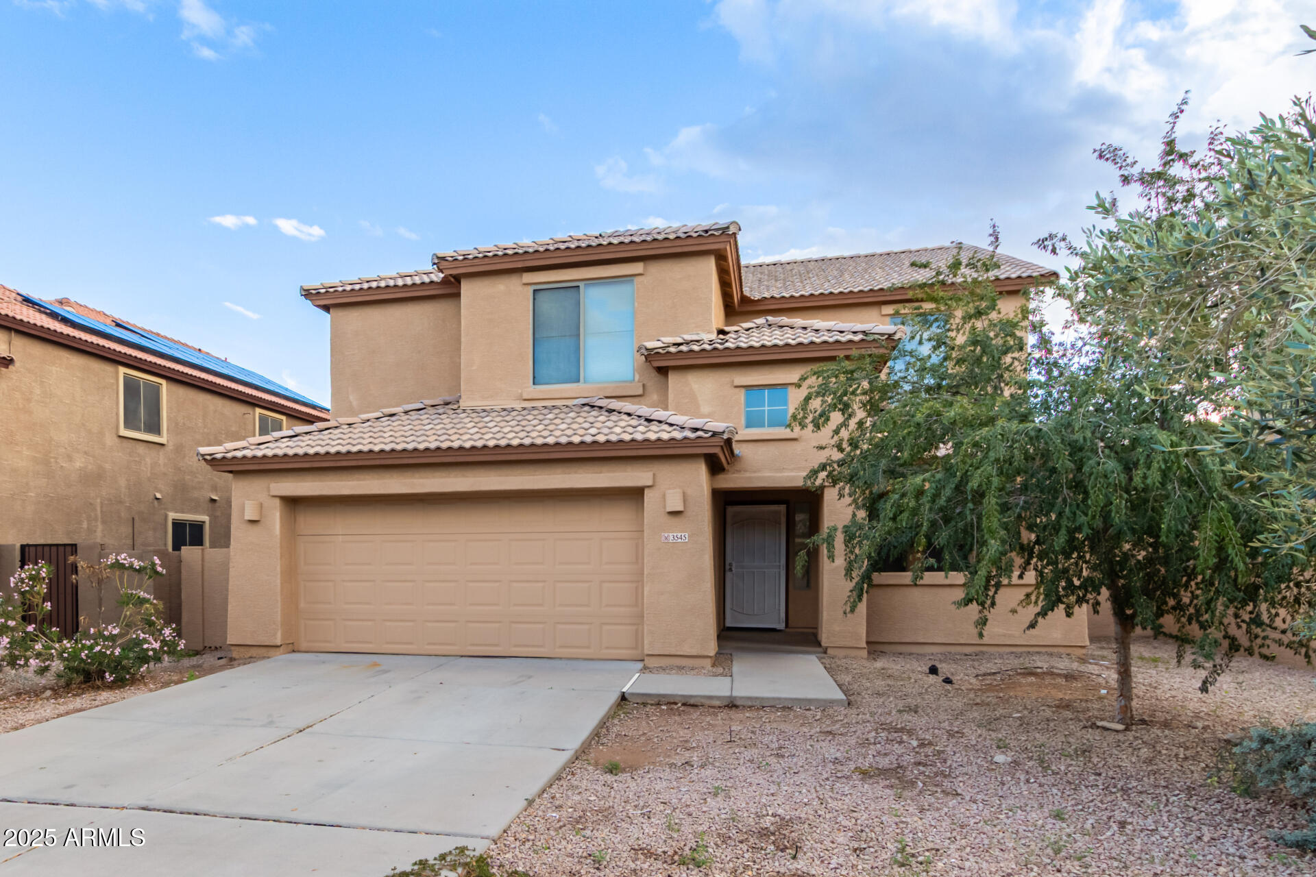 3545 East Crescent Way Gilbert, AZ 85298 - Photo 2 of 39 a front view of a house with a garage