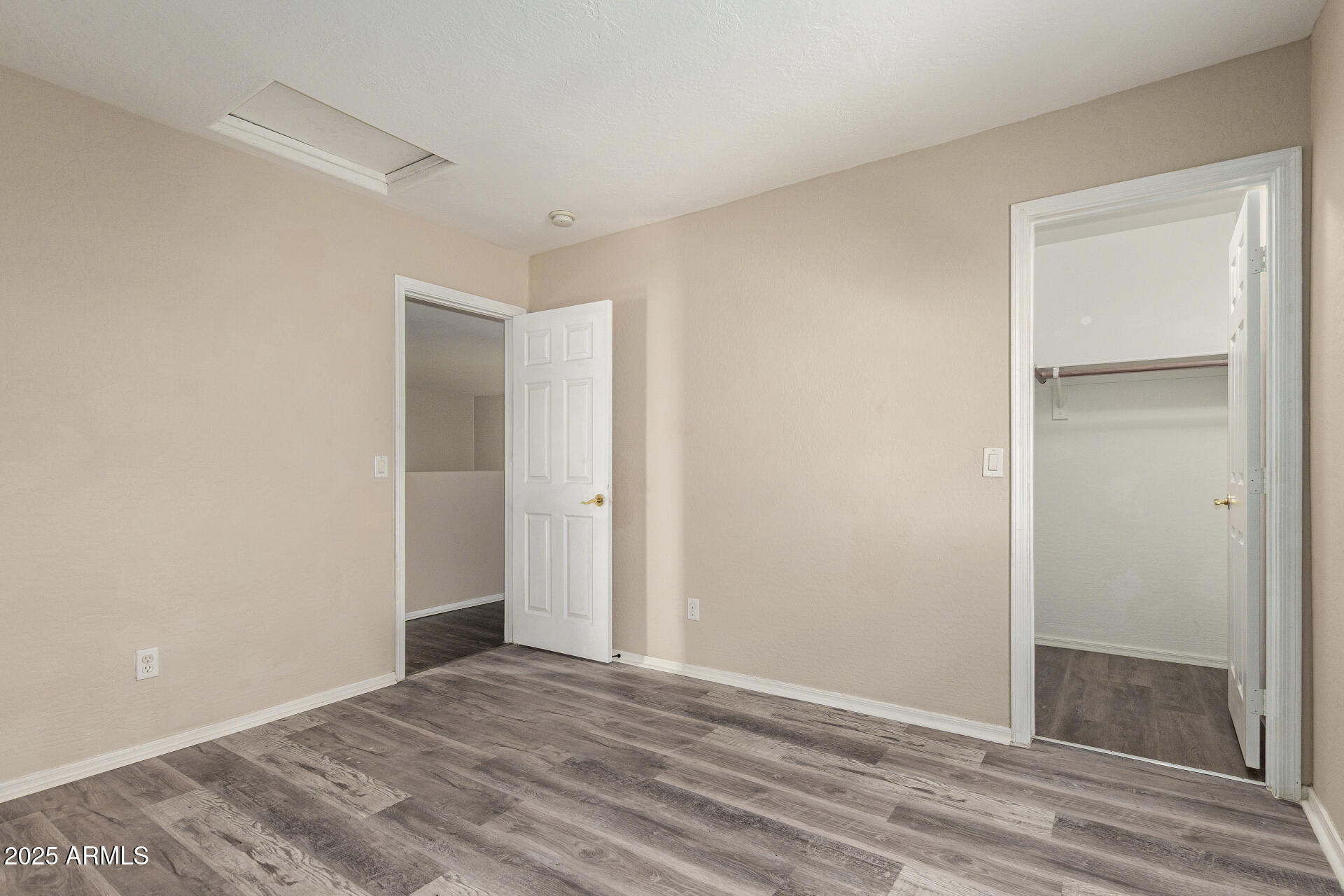 3545 East Crescent Way Gilbert, AZ 85298 - Photo 24 of 39 a view of an empty room and wooden floor