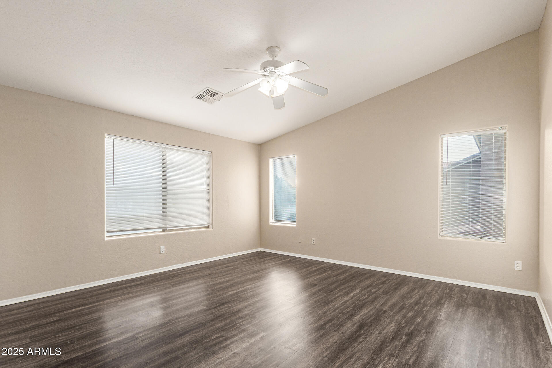 3545 East Crescent Way Gilbert, AZ 85298 - Photo 27 of 39 a view of an empty room with wooden floor and a window