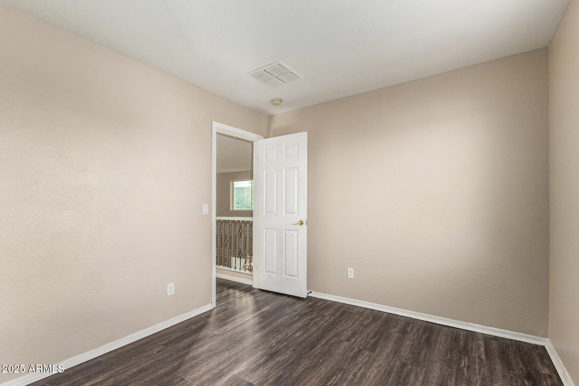 3545 East Crescent Way Gilbert, AZ 85298 - Photo 28 of 39 a view of an empty room and wooden floor