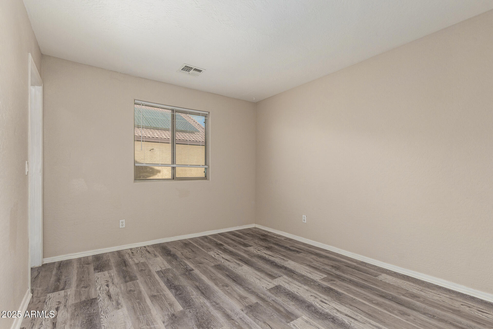 3545 East Crescent Way Gilbert, AZ 85298 - Photo 36 of 39 an empty room with a window