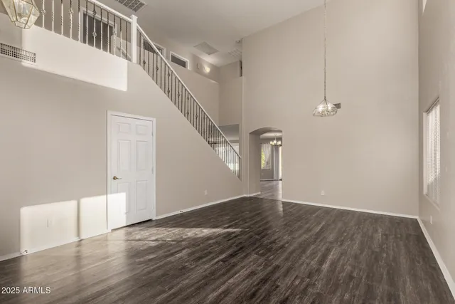 a kitchen with stainless steel appliances granite countertop a stove a sink dishwasher a refrigerator and a microwave