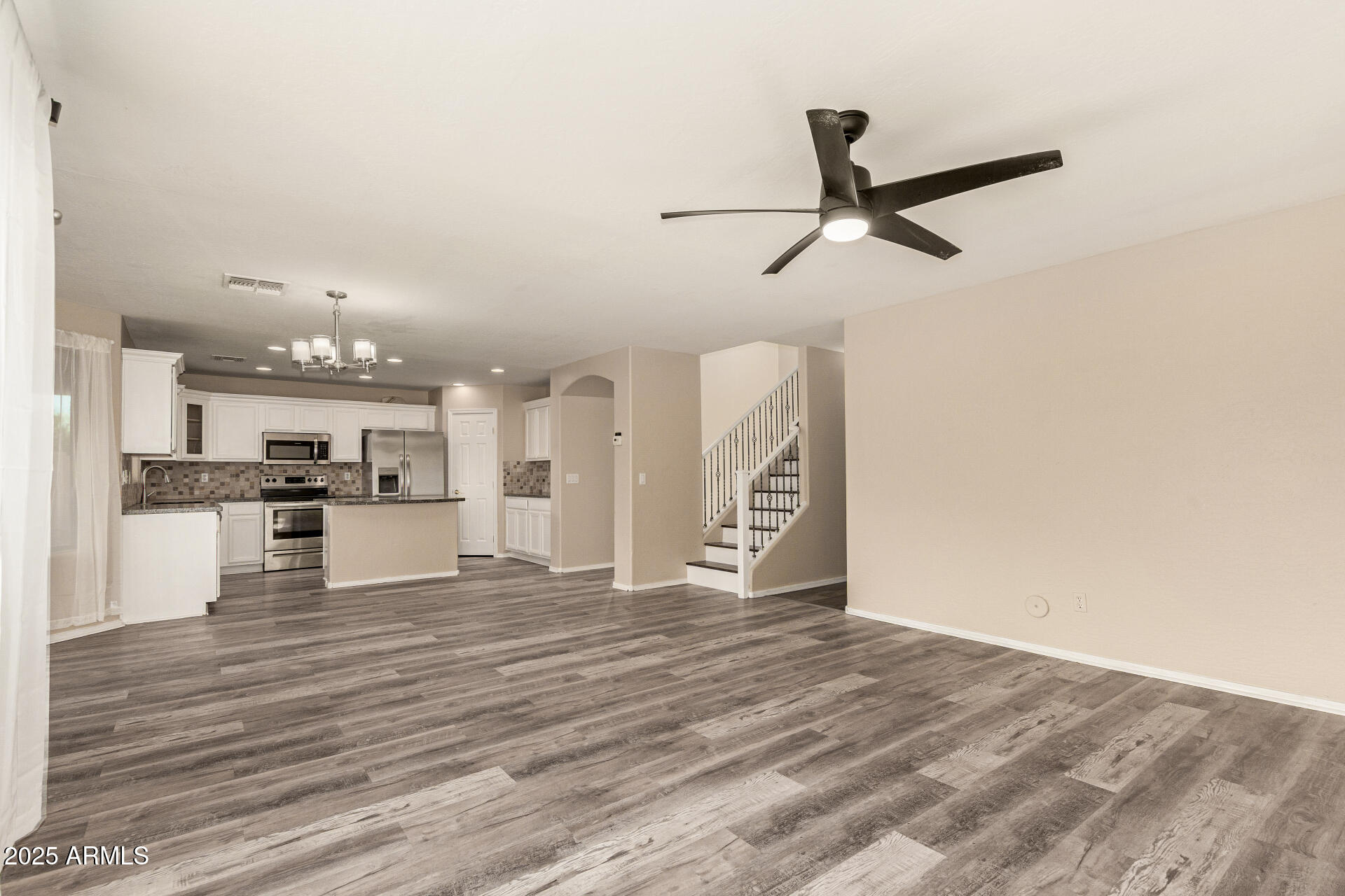 3545 East Crescent Way Gilbert, AZ 85298 - Photo 6 of 39 a view of a kitchen with a sink and dishwasher a refrigerator with wooden floor