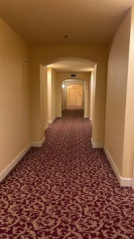 a view of a room with a wooden door