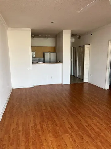 a view of a kitchen with wooden floor