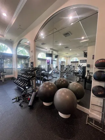 a room with lots of furniture and a chandelier