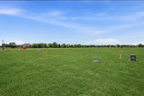 a view of a lake with houses in the background