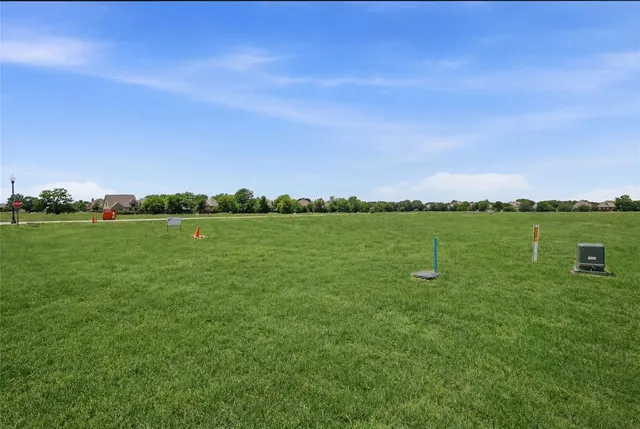 a view of a lake with houses in the background