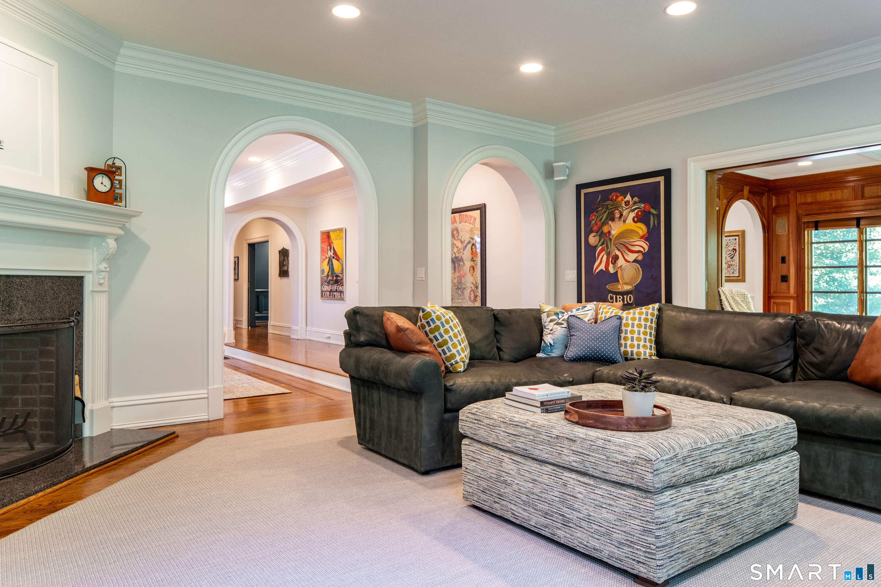 760 Smith Ridge Road New Canaan, CT 06840 - Photo 13 of 40 a living room with furniture and a fireplace