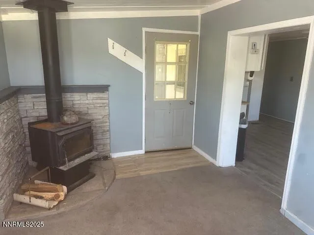 a view of an entryway and livingroom with furniture