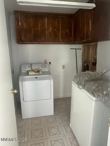 a utility room with washer and dryer