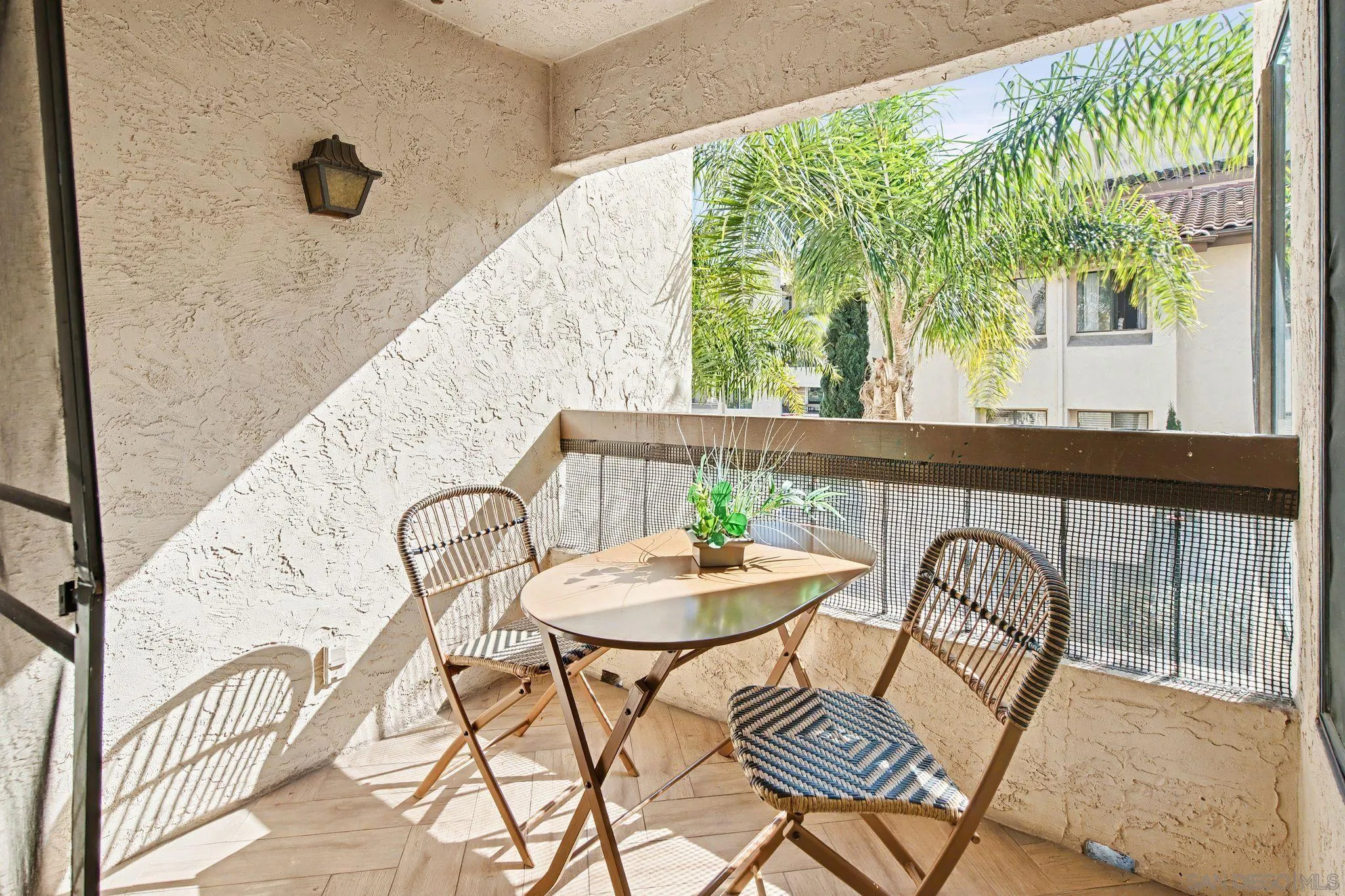 6757 Friars Road, Unit 21 San Diego, CA 92108 - Photo 11 of 40 a table and chairs in a balcony
