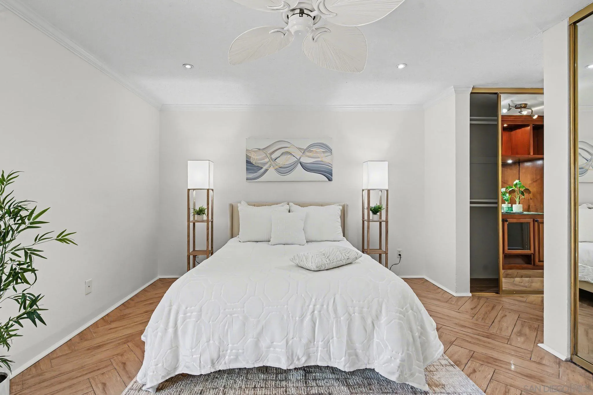 6757 Friars Road, Unit 21 San Diego, CA 92108 - Photo 13 of 40 a bedroom with a bed and a chandelier