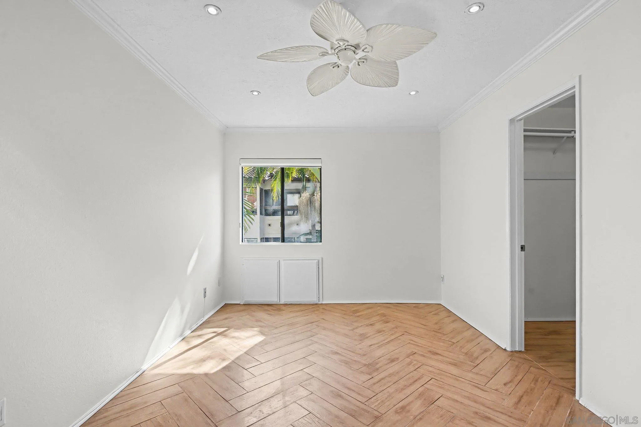 6757 Friars Road, Unit 21 San Diego, CA 92108 - Photo 23 of 40 a view of a bedroom with a bed and a window