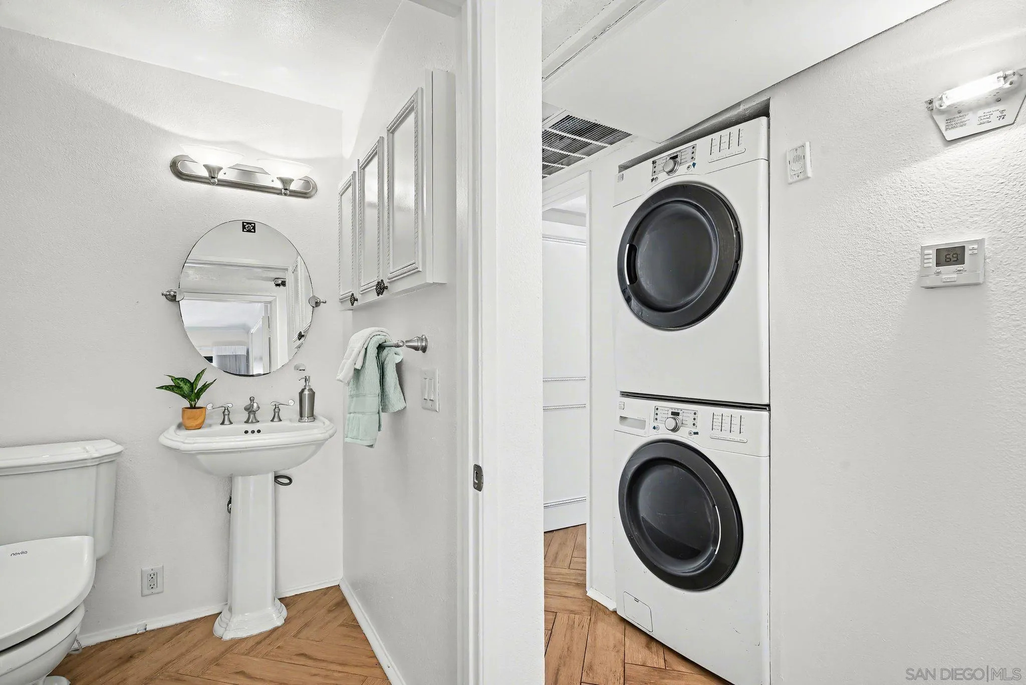 6757 Friars Road, Unit 21 San Diego, CA 92108 - Photo 30 of 40 a view of a hallway with washer and dryer