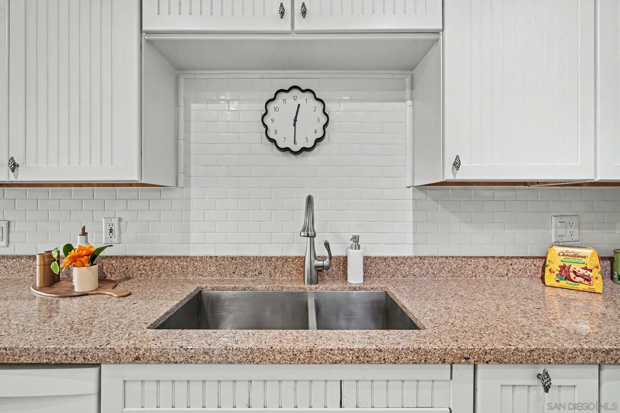 6757 Friars Road, Unit 21 San Diego, CA 92108 - Photo 9 of 40 a kitchen with granite countertop a sink and cabinets
