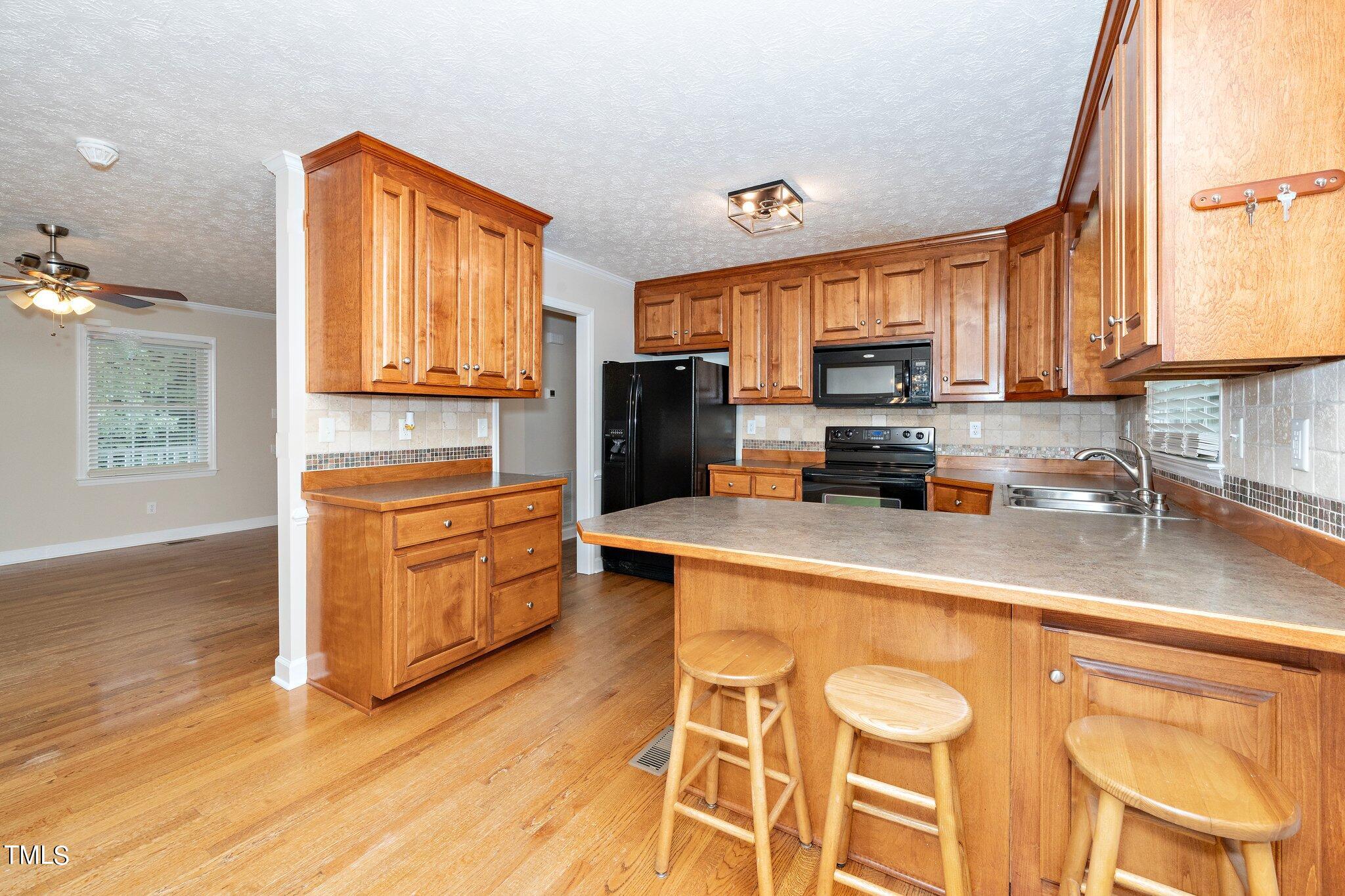 1678 Hayes Road Creedmoor, NC 27522 - Photo 12 of 25 1678 Hayes Road - Kitchen view of family