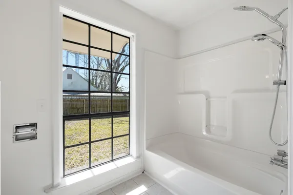 a white sink under a mirror