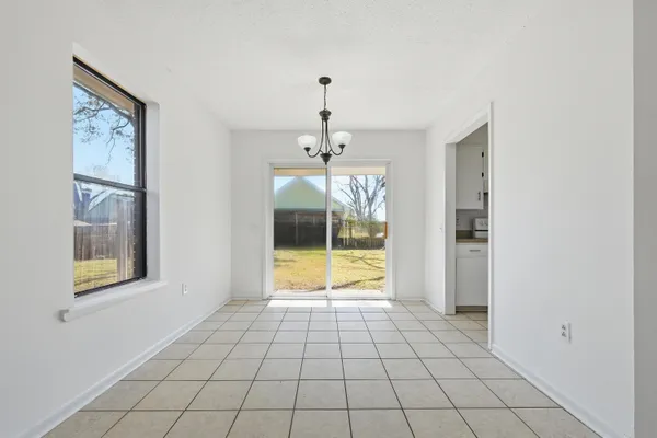 a view of an empty room and window
