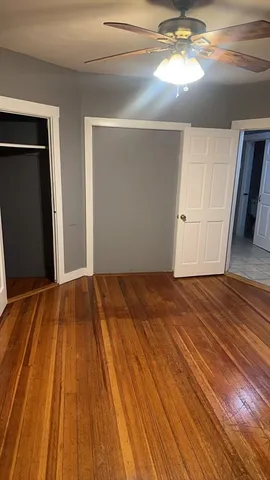 a view of a livingroom with wooden floor