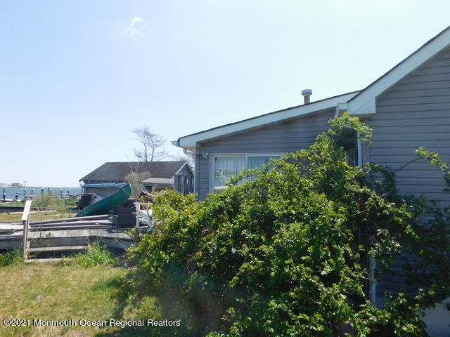 29 Metedeconk Road Brick, NJ 08723 - Photo 11 of 14 a view of a house with a yard and sitting area