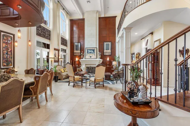 a living room filled with furniture and a potted plant